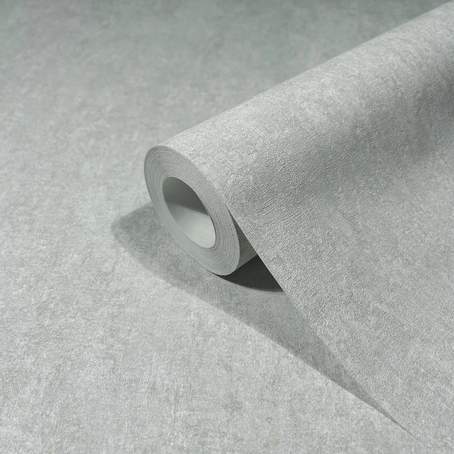 Marburg 35137 wallpaper close-up roll with subtle textured light gray surface.