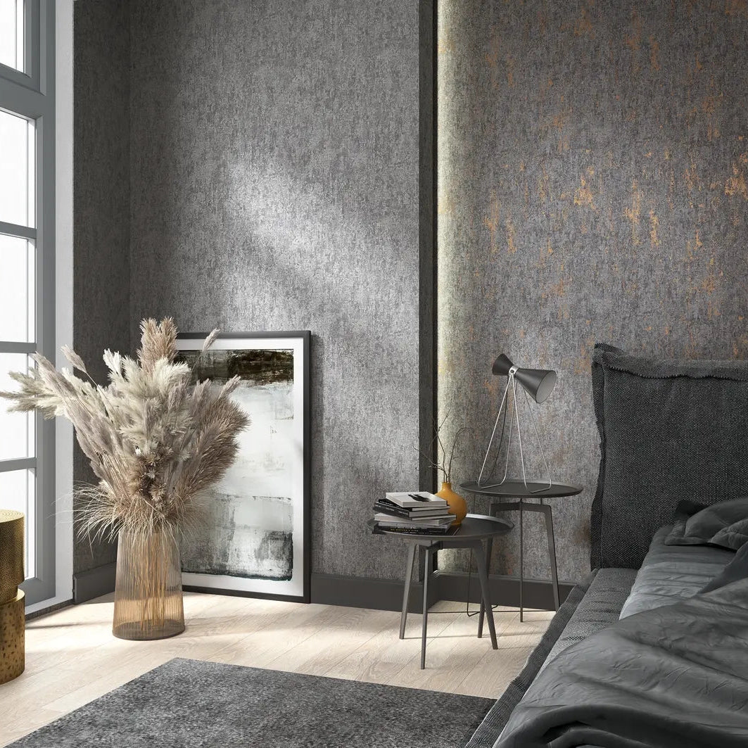 Marburg 35142 wallpaper in a modern bedroom, textured grey feature wall behind a low bed, nesting side tables with lamp and books, pampas grass in a glass vase and framed art by a tall window, calm and.