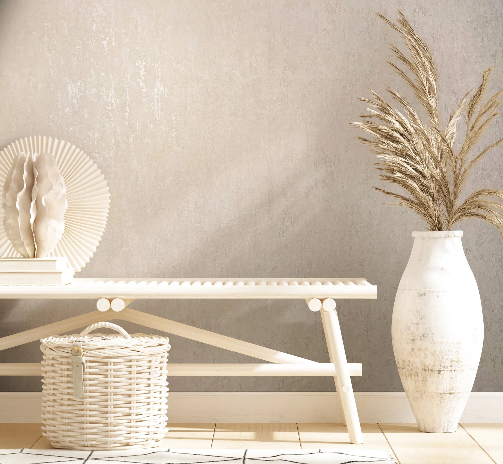 Marburg 35145 wallpaper lounge feature wall behind a minimalist bench with wicker basket, sculptural decor, and tall vase of dried grasses, calm and airy.