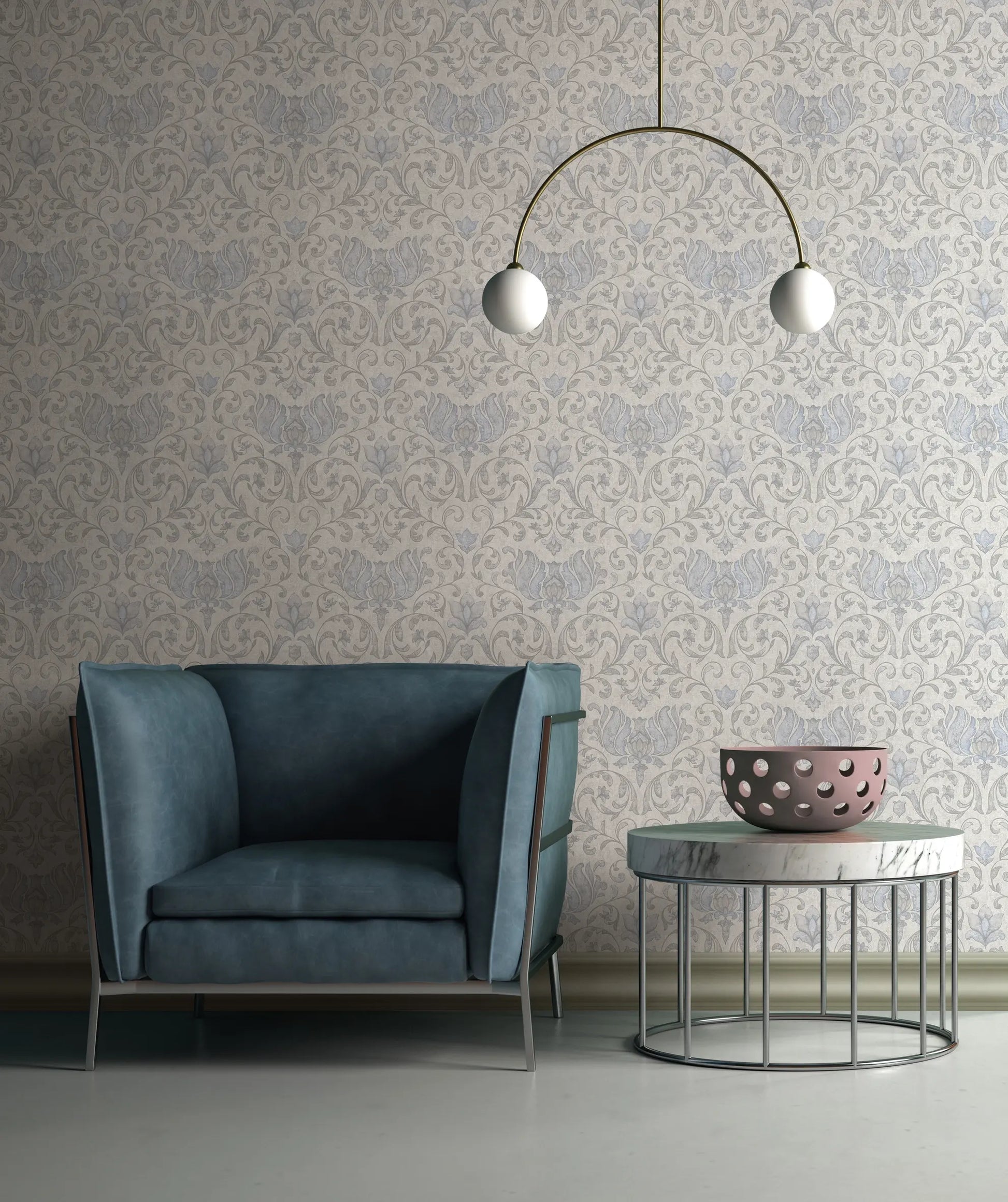 Marburg 35147 wallpaper lounge feature wall behind a blue armchair, round marble-top side table with pink bowl, and two-globe pendant light for a calm contemporary feel.
