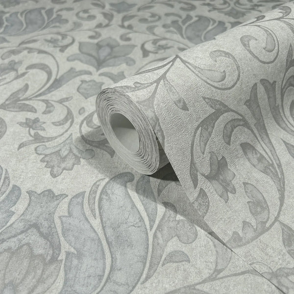 Marburg 35147 wallpaper roll close-up with large-scale scrolling floral damask pattern in light and dark grey.