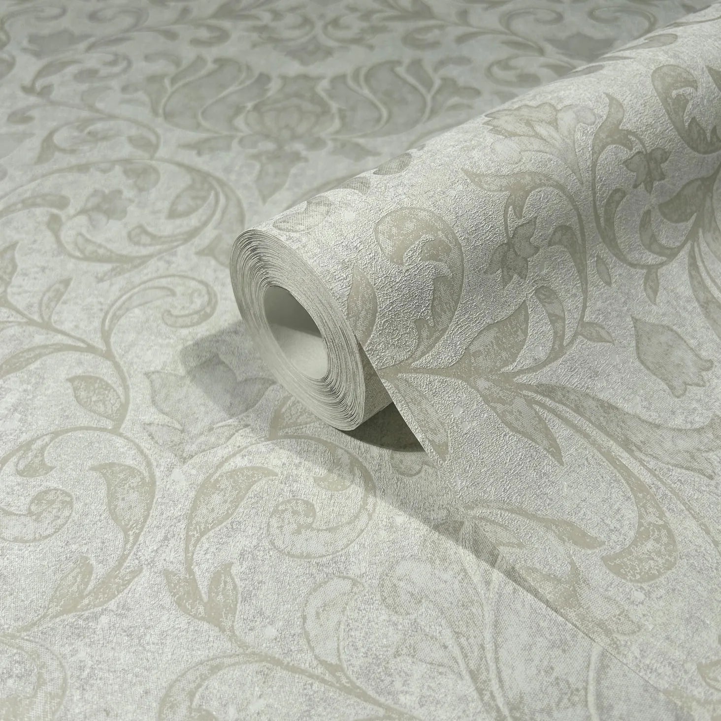 Marburg 35148 wallpaper roll with textured floral vine damask pattern in light neutral tones, close-up detail.