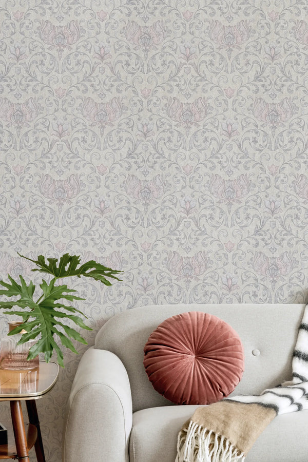 Marburg 35150 wallpaper on a lounge feature wall behind a light sofa with a round cushion, striped throw, side table and leafy plant for a calm, cozy feel.