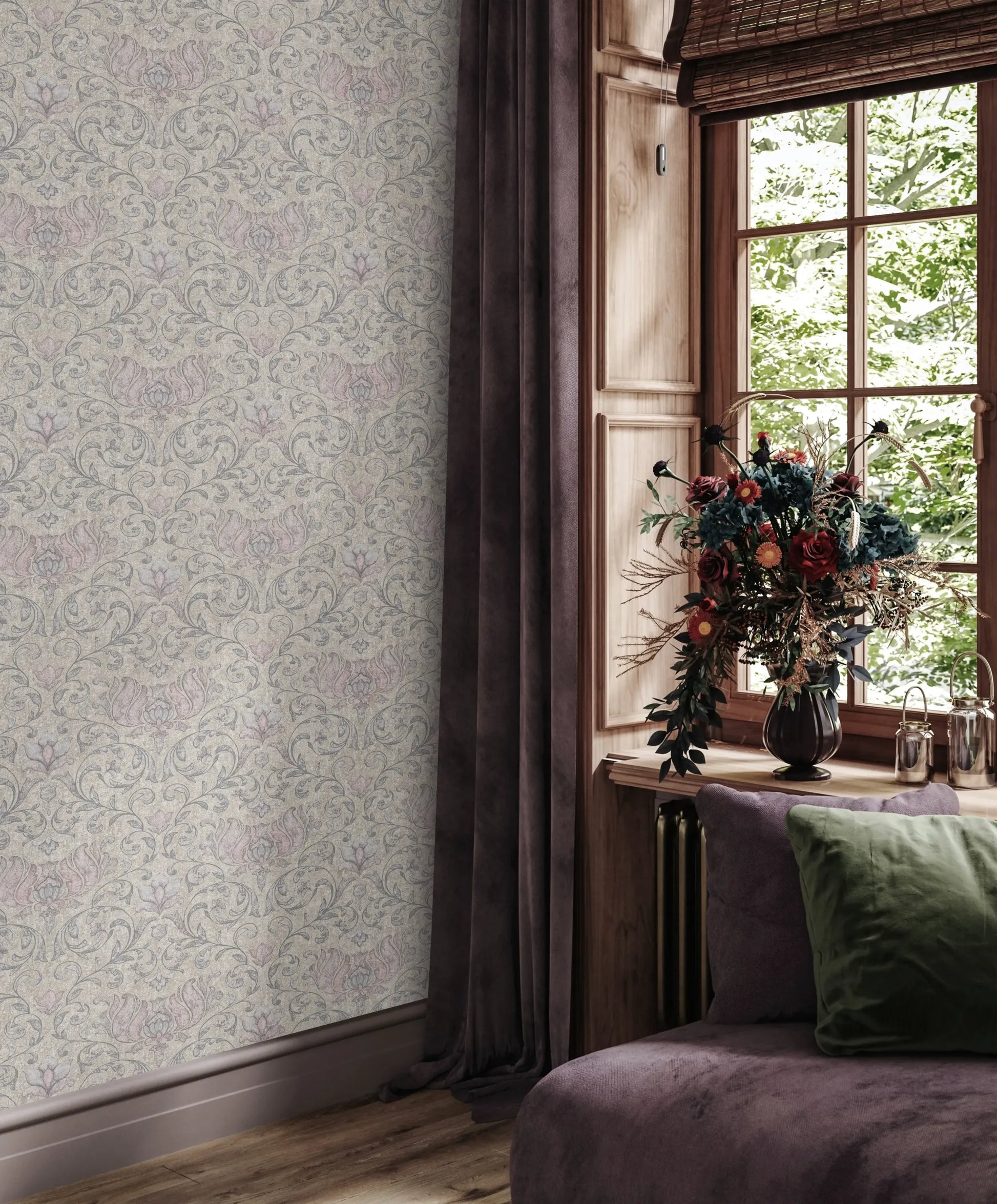 Marburg 35152 wallpaper in a lounge feature wall beside a wood-framed window with woven blind, dark drapes, a plush chaise with a green cushion, and a vase of flowers for a cozy, elegant feel.