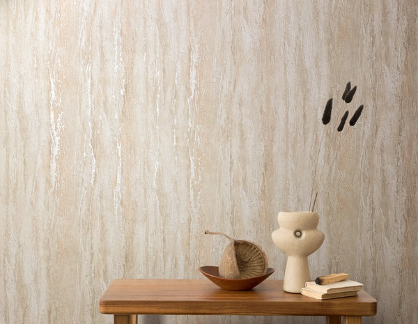 Marburg 35154 wallpaper lounge feature wall behind a wooden console table with a sculptural ceramic vase, dried stems, stacked books and a shallow bowl, serene minimalist feel.