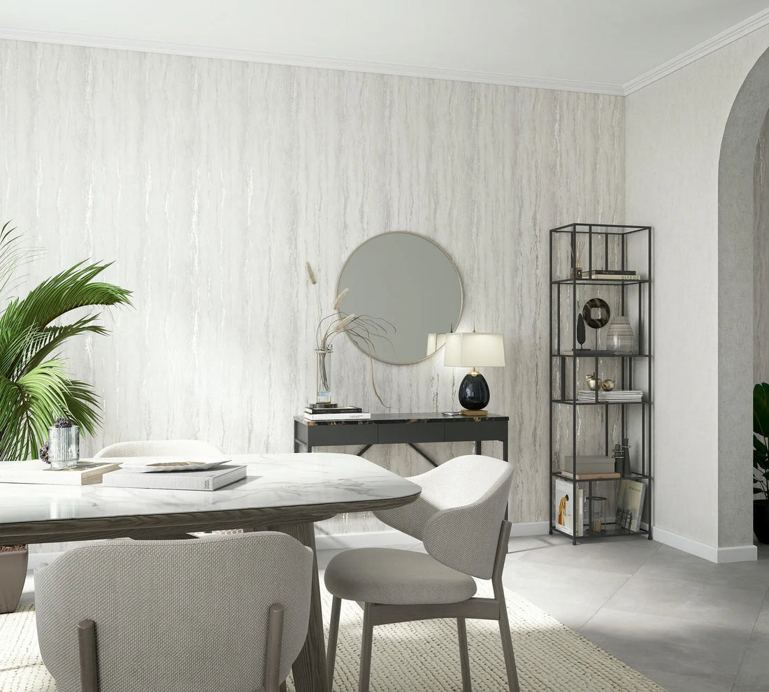 Marburg 35155 wallpaper feature wall in a modern lounge with console and round mirror, stone-top dining table and upholstered chairs, open metal shelving, potted palm, calm and airy.