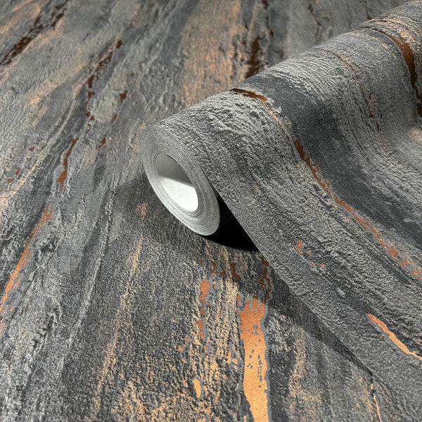 Marburg 35156 wallpaper with charcoal gray stone-like texture and metallic copper streaks, close-up detail.