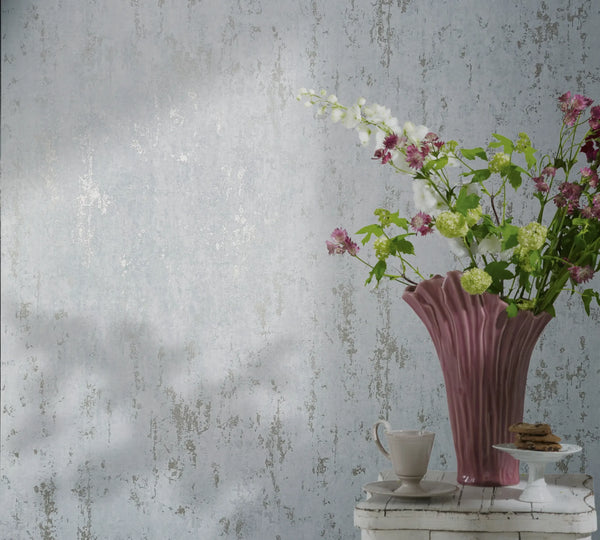 Marburg 35162 wallpaper in a lounge feature wall behind a white side table with a pink fluted vase of flowers, a cup and cookies, calm and elegant.