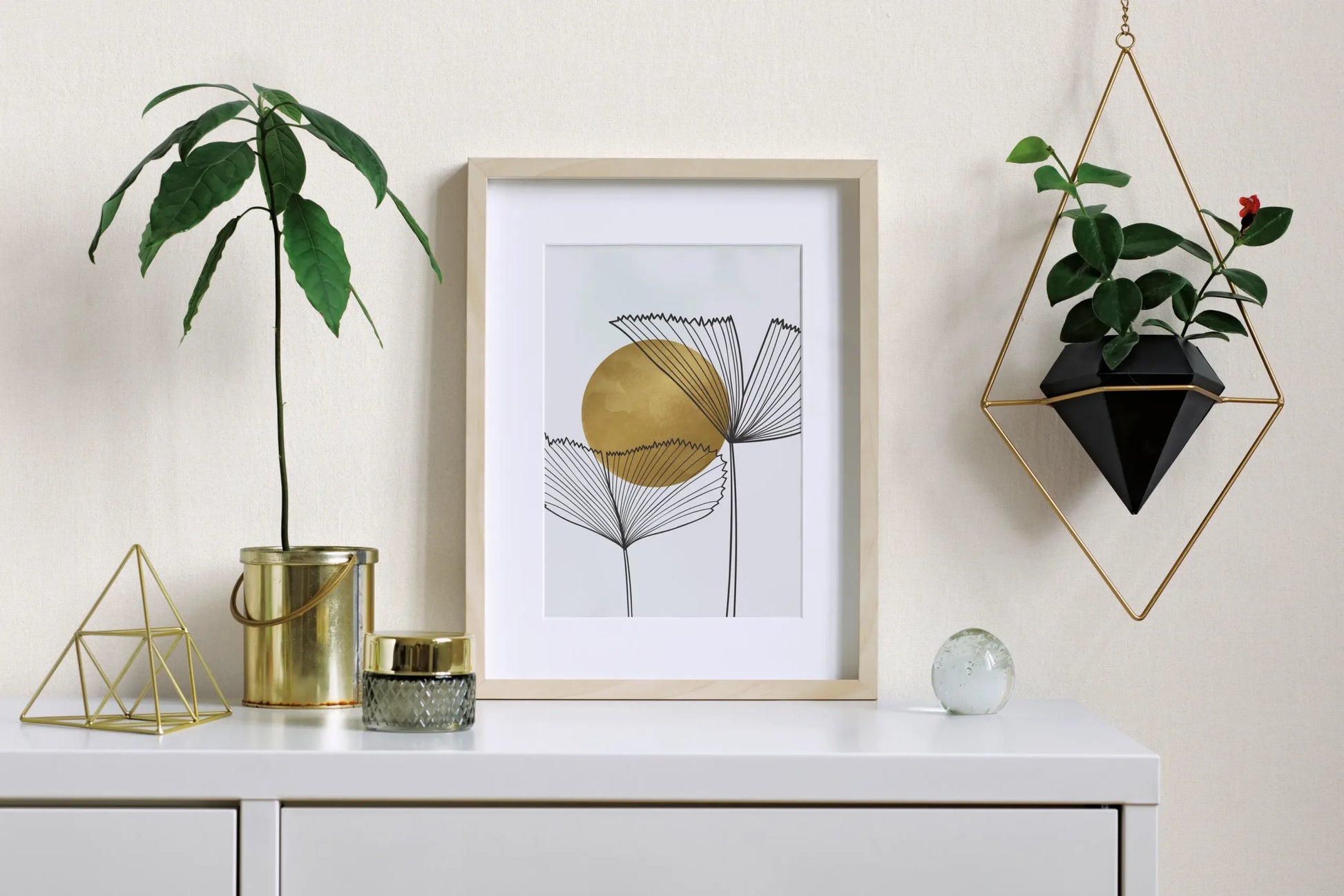 Marburg 47601 wallpaper entryway feature wall behind a white sideboard with framed art, small plants, geometric metal accents, and a calm minimalist vibe.
