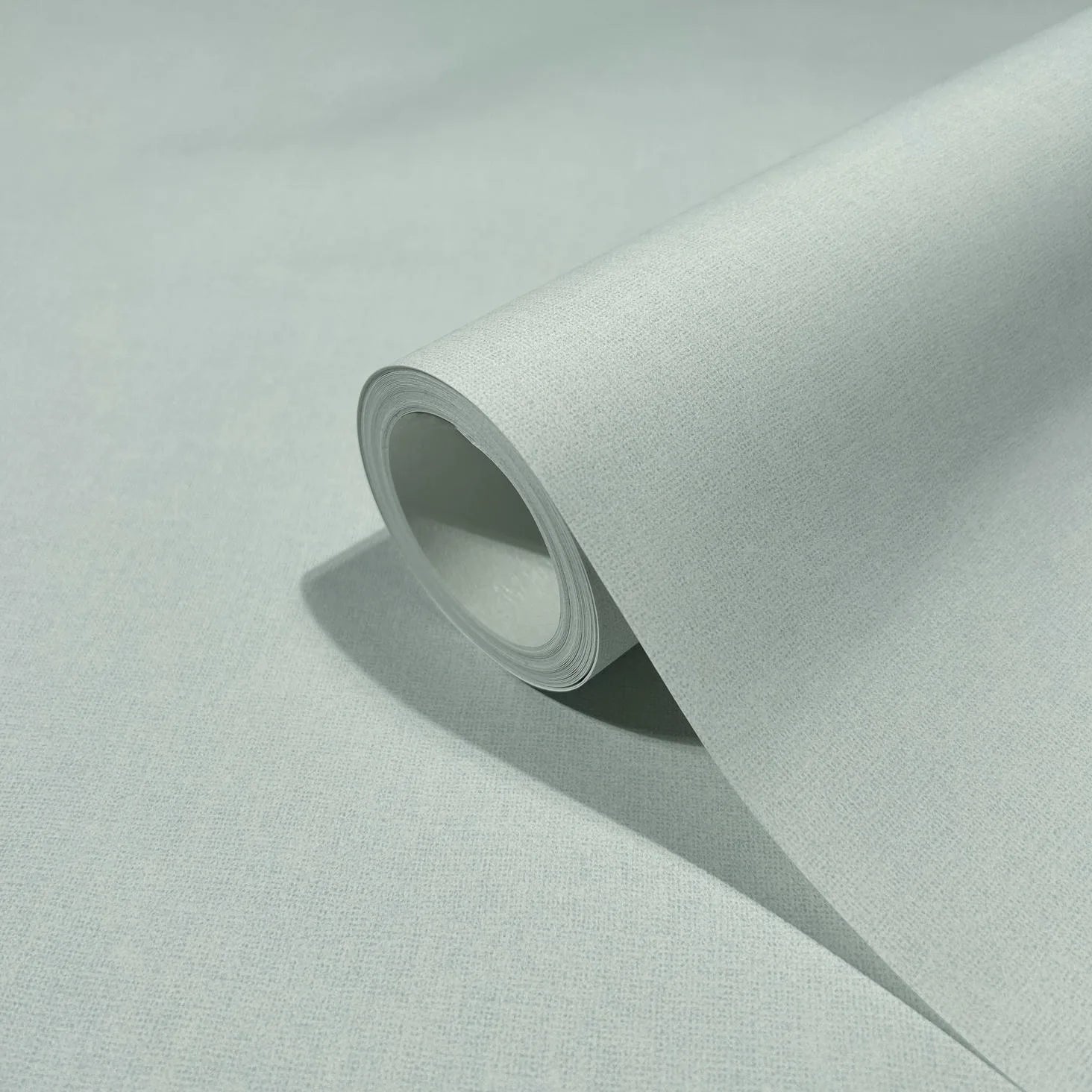 Marburg 47604 wallpaper close-up of a single roll showing fine textured surface on a neutral background.