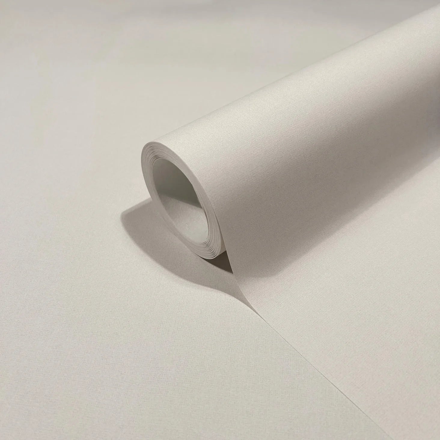Marburg 47607 wallpaper close-up roll with fine textured surface.