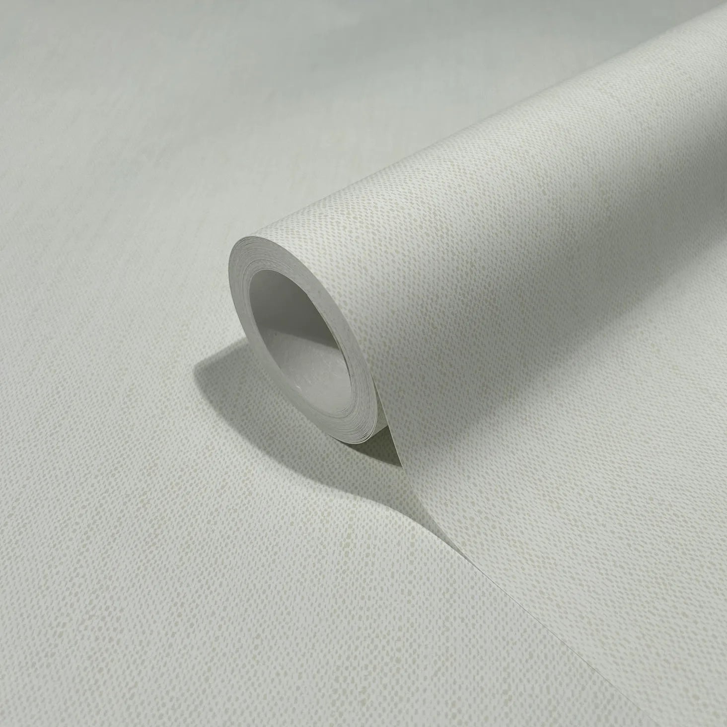 Marburg 47612 wallpaper close-up of subtly textured neutral roll on a flat surface.