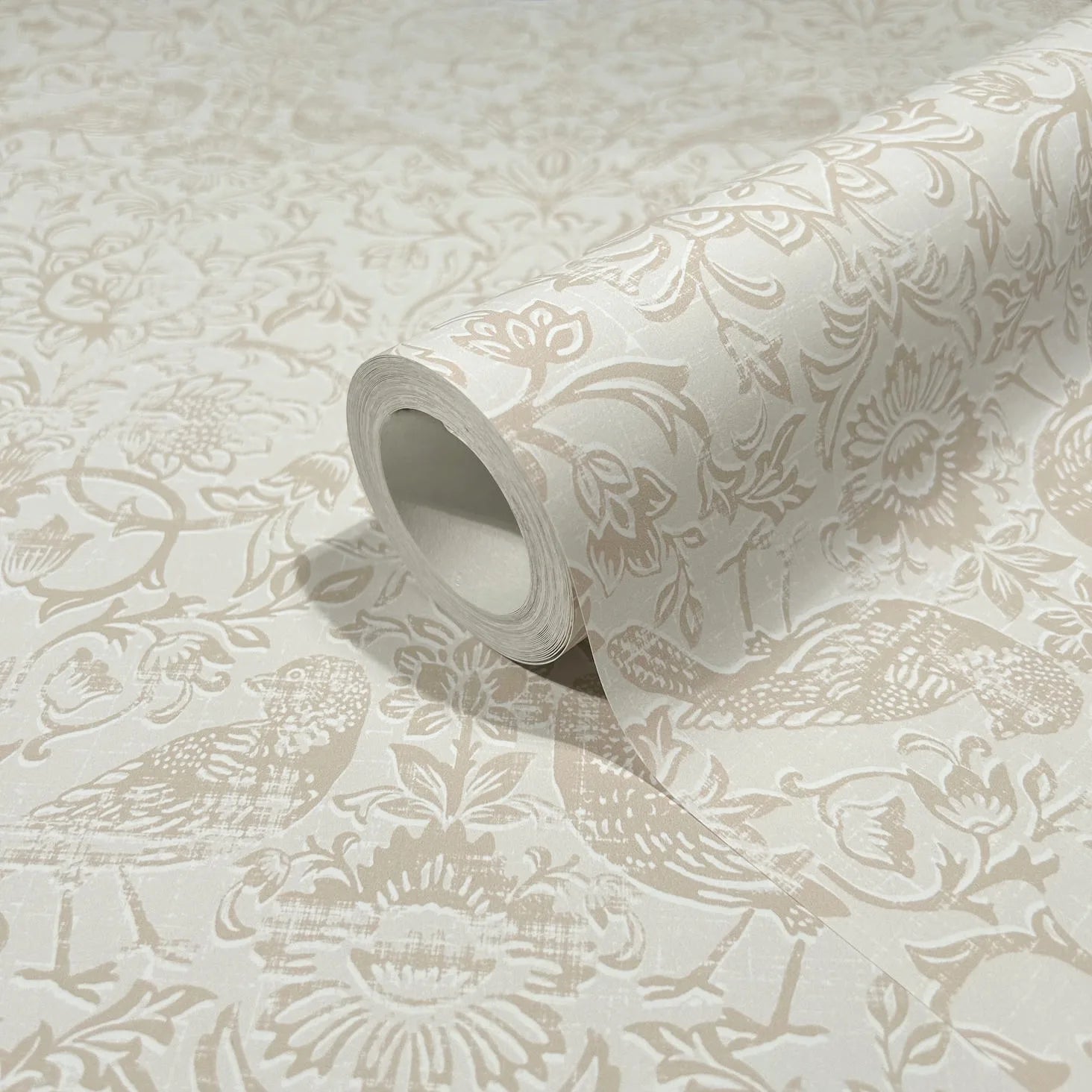 Marburg 47625 wallpaper roll close-up showing textured floral and bird pattern in soft neutrals.