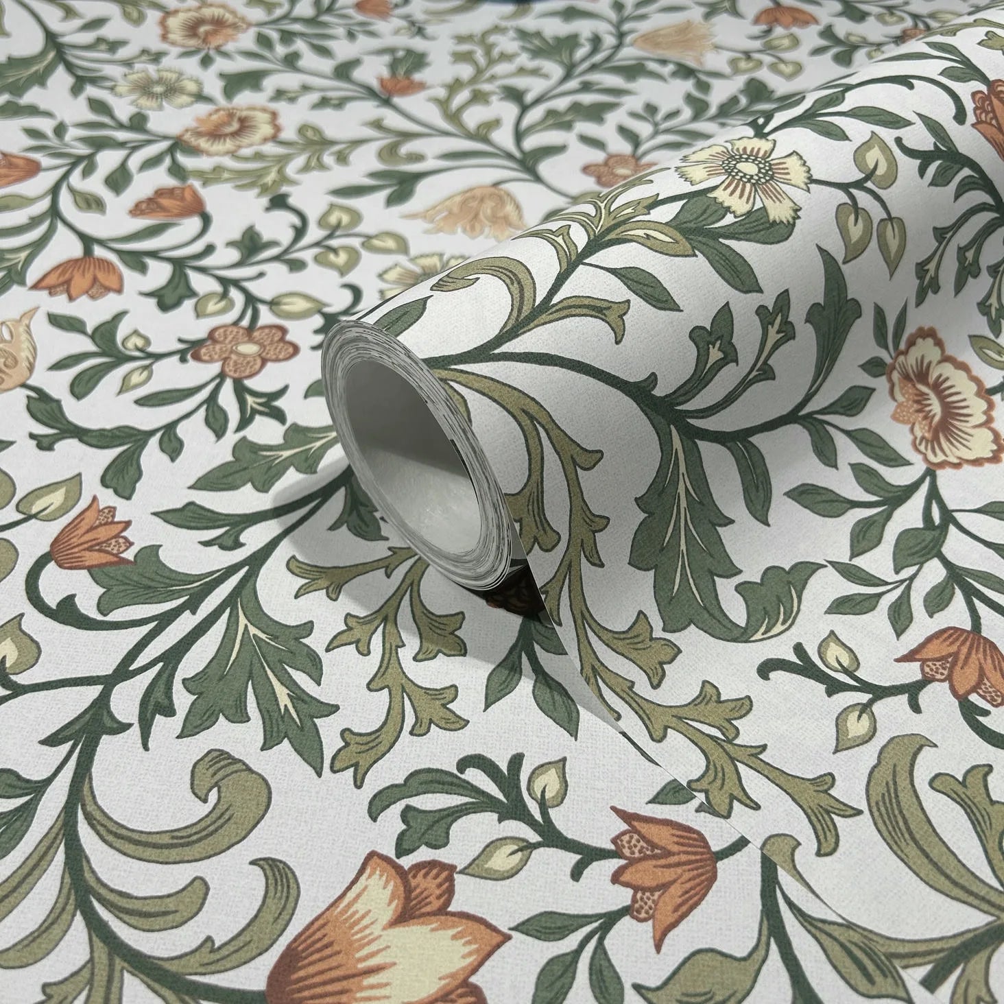 Marburg 47626 wallpaper close-up roll with green vines and orange and cream flowers on light background.
