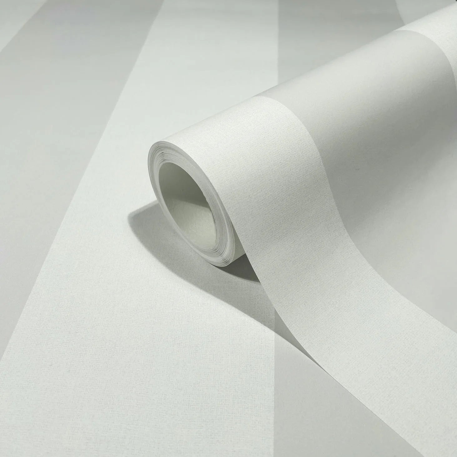 Marburg 47634 wallpaper roll close-up showing wide tonal vertical stripes and fine textured finish.