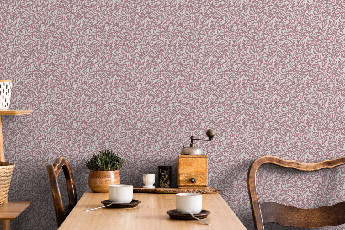 Marburg 47638 wallpaper lounge feature wall behind a rustic wooden table with vintage chairs, coffee cups, a manual grinder, a small potted plant and woven basket accents for a cozy relaxed vibe.