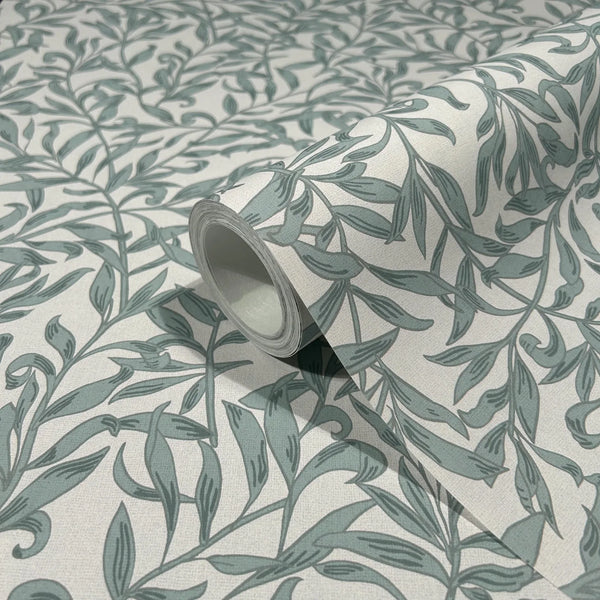 Marburg 47639 wallpaper close-up of rolled sample with green botanical vine pattern on a light background.