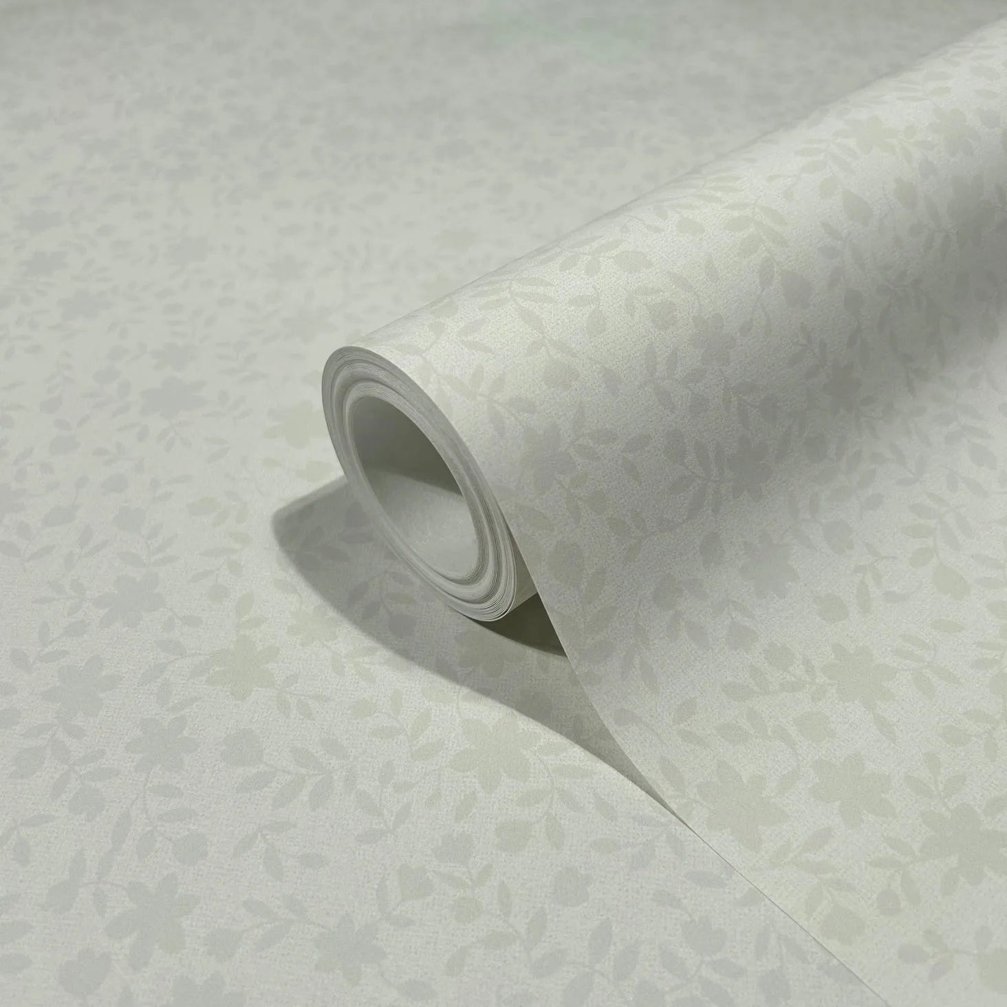 Marburg 47643 wallpaper close-up roll with subtle tone-on-tone floral and leaf pattern.