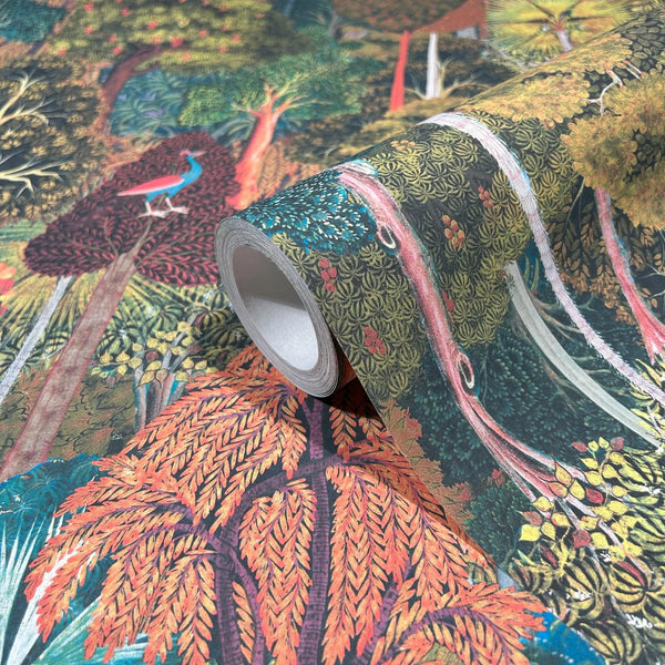 Marburg 47652 wallpaper roll close-up showing dense woodland illustration with trees, foliage, and a peacock.