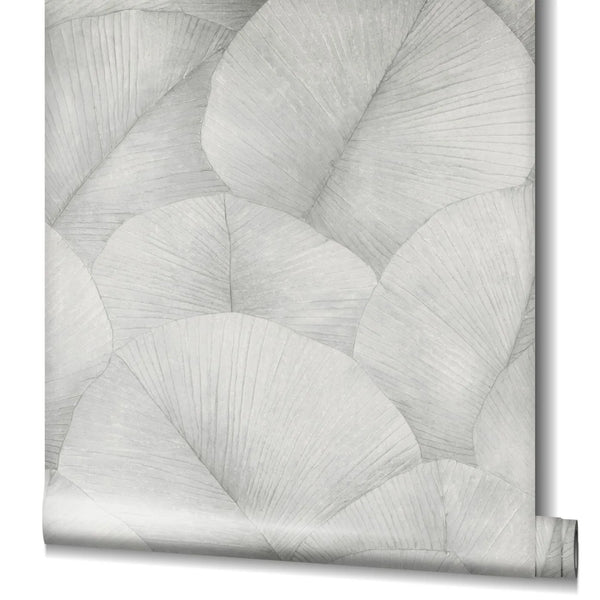 Marburg Kumano 34509 Partially unrolled wallpaper roll displaying large overlapping fan-like leaves in soft gray, with the rolled end visible at the bottom right.