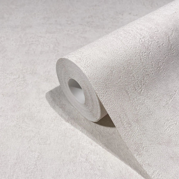 Marburg Kumano 34521 Close-up of a textured wallpaper roll resting on a matching unrolled sheet in a light tone.