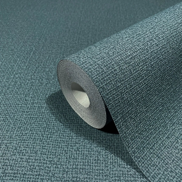 Marburg Kumano 34524 Close-up of a blue textured wallpaper roll with a small grid pattern, shown partly unrolled on matching material.