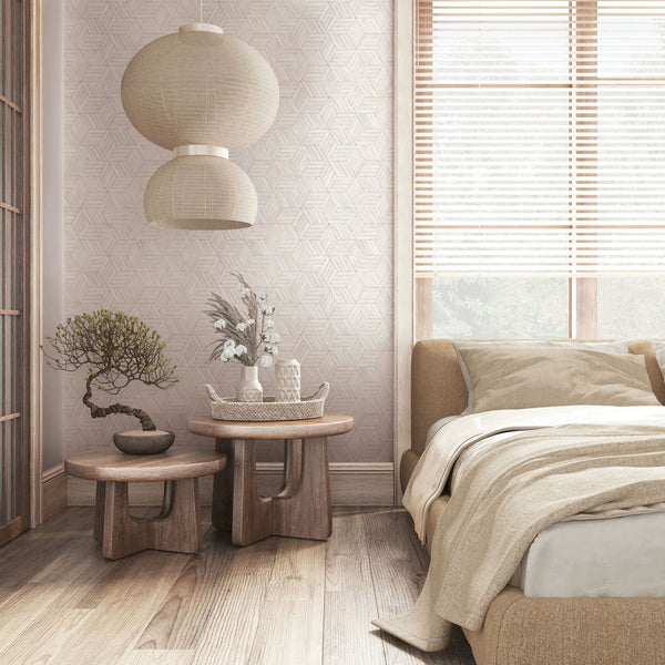 Marburg Leyla 81699 Light neutral geometric line wallpaper on a bedroom feature wall behind a low upholstered bed, two nested wooden side tables with a bonsai and a vase, and twin fabric pendant lamps beside a window with blinds.