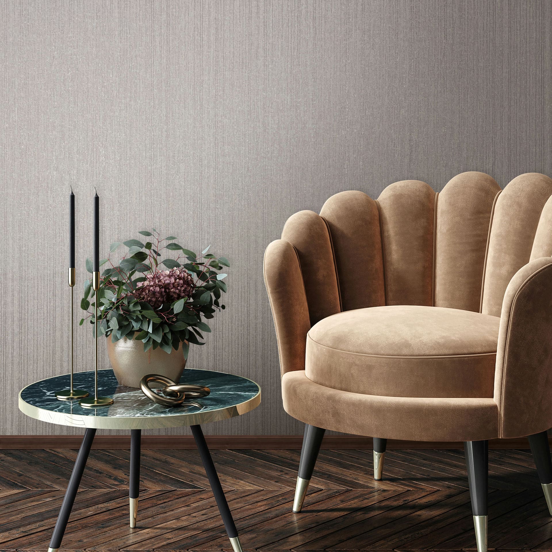 Marburg Leyla 82444 Gray wallpaper with subtle vertical striations behind a scalloped tan armchair and a round marble-topped side table with two tall black candles and a potted arrangement.