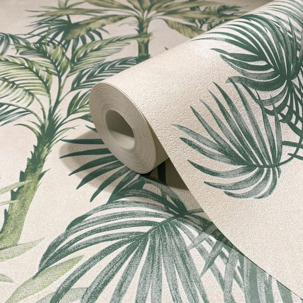 Marburg Leyla 82456 Close-up of a wallpaper roll on a matching sheet featuring green palm leaves on a textured beige background.