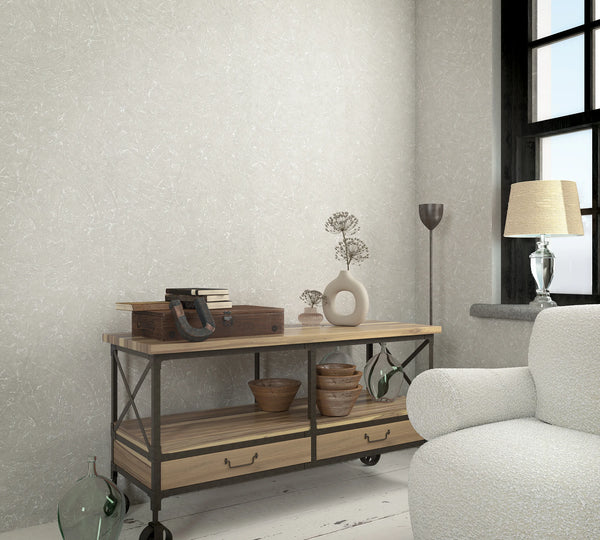 Marburg Loft Superior 34152 Subtle abstract plaster-effect pattern with fine white streaks on a light beige-gray ground wallpaper on a living room feature wall.