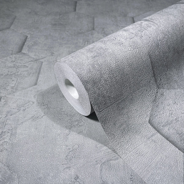 Marburg Loft Superior 34160 A gray textured wallpaper roll resting on the same pattern, showing an embossed stone-like surface with faint geometric shapes.