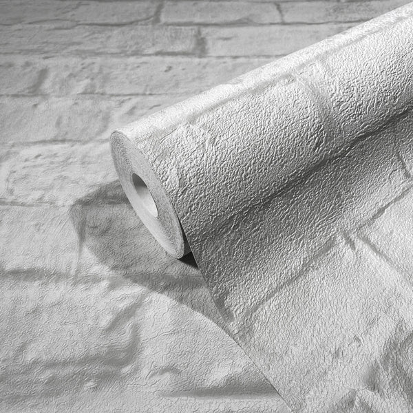 Marburg Loft Superior 34166 Wallpaper roll resting on a matching unrolled sheet, showing a raised textured stone-block pattern.