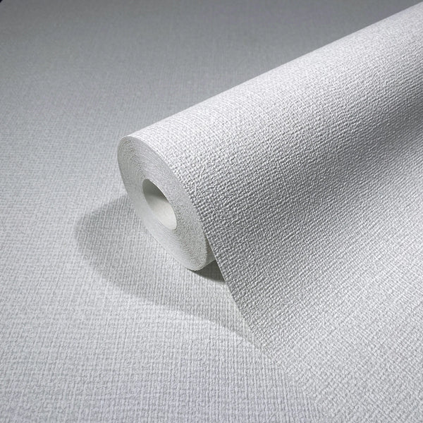 Marburg Loft Superior 34171 Close-up of a white textured wallpaper roll showing a fine crosshatch grid on a matching unrolled sheet.