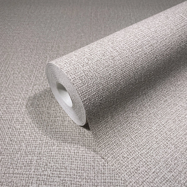 Marburg Loft Superior 34176 Close-up of a wallpaper roll with a textured crosshatch pattern resting on matching unrolled wallpaper.