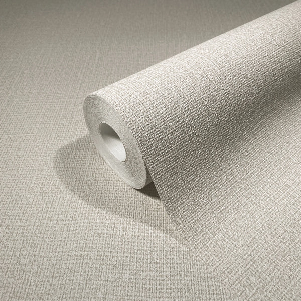 Marburg Loft Superior 34177 Close-up of a beige textured wallpaper roll on a matching surface, showing a fine crosshatch texture.