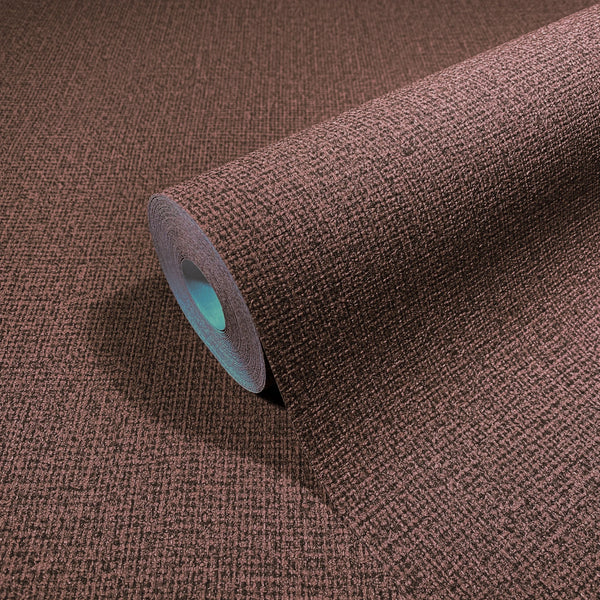Marburg Loft Superior 34179 A roll of textured brown wallpaper with a subtle crosshatch pattern shown on a matching surface.