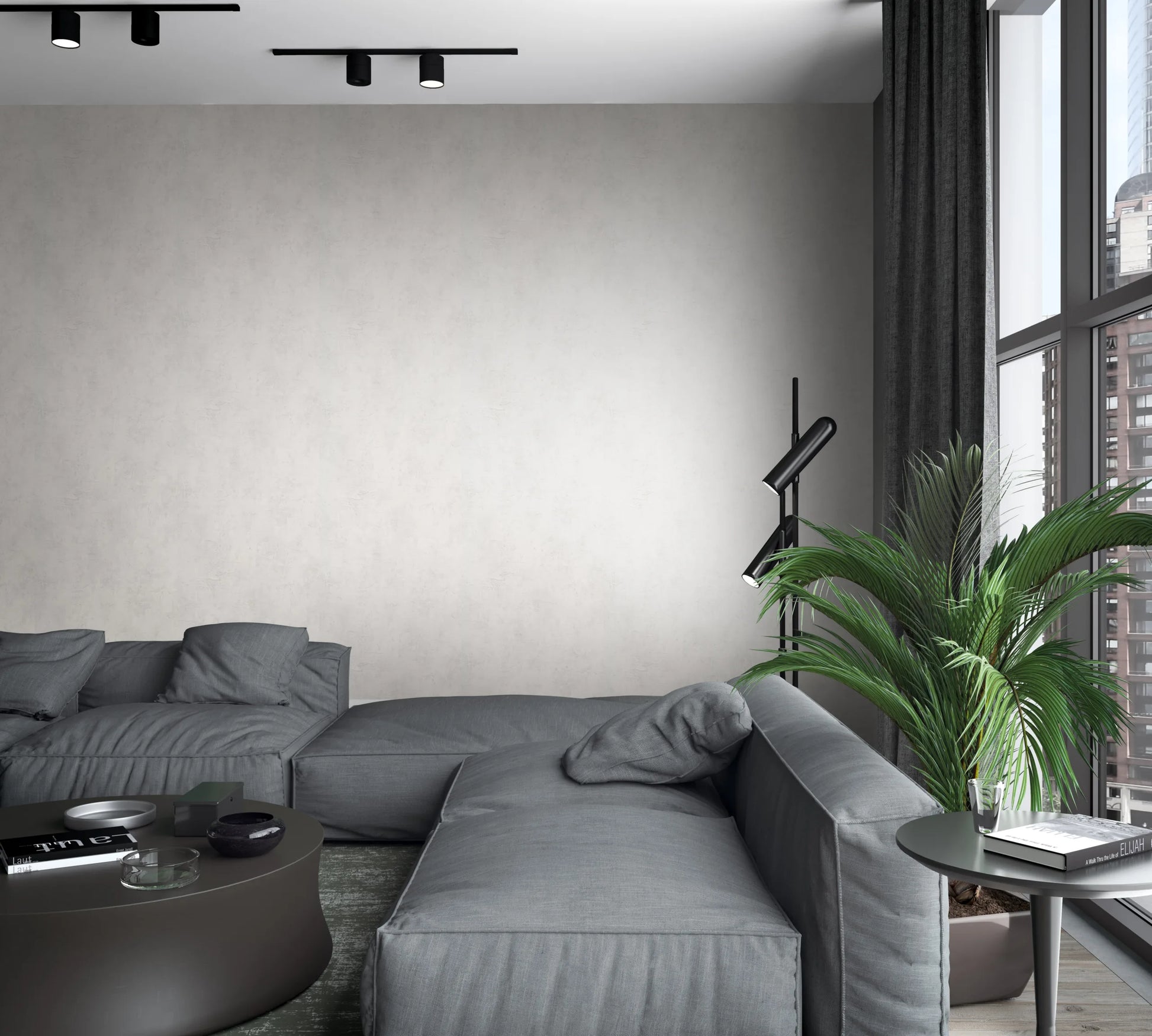 Marburg Loft Superior 34186 Light beige mottled wallpaper on the main wall behind a gray sectional sofa, with round tables, a floor lamp, a potted palm, curtains, and large windows showing city buildings.