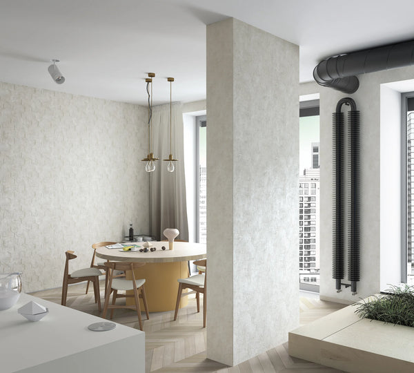 Marburg Loft Superior 34186 Wide view of a modern dining area featuring light beige geometric patterned wallpaper on the back wall, a round dining table with wooden chairs, pendant lights, a tall column, and large windows with a city view.