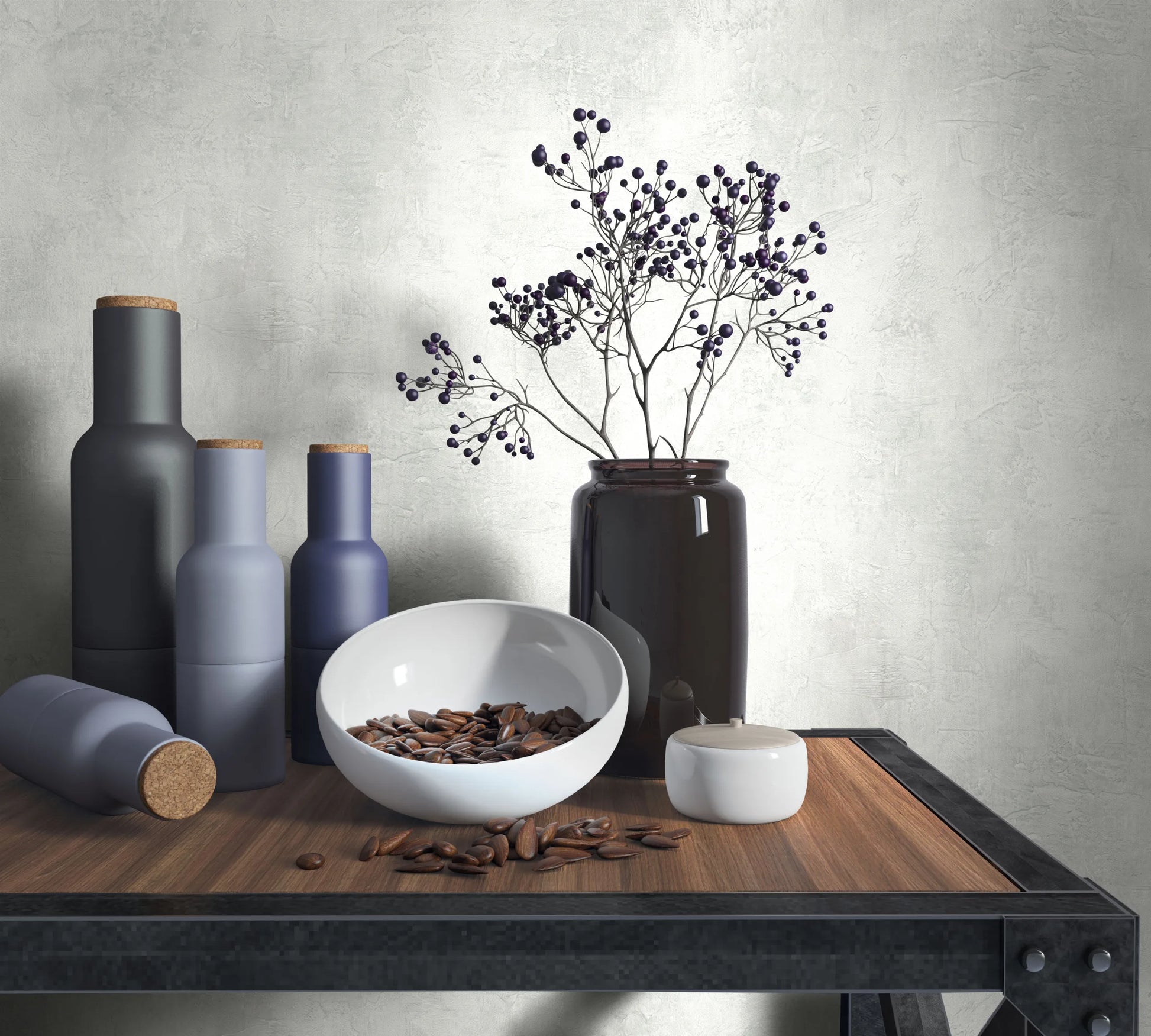 Marburg Loft Superior 34192 Light gray plaster-effect wallpaper behind a wood-and-metal table styled with matte bottles, a white bowl, a small lidded jar, and a dark glass vase holding delicate branches.