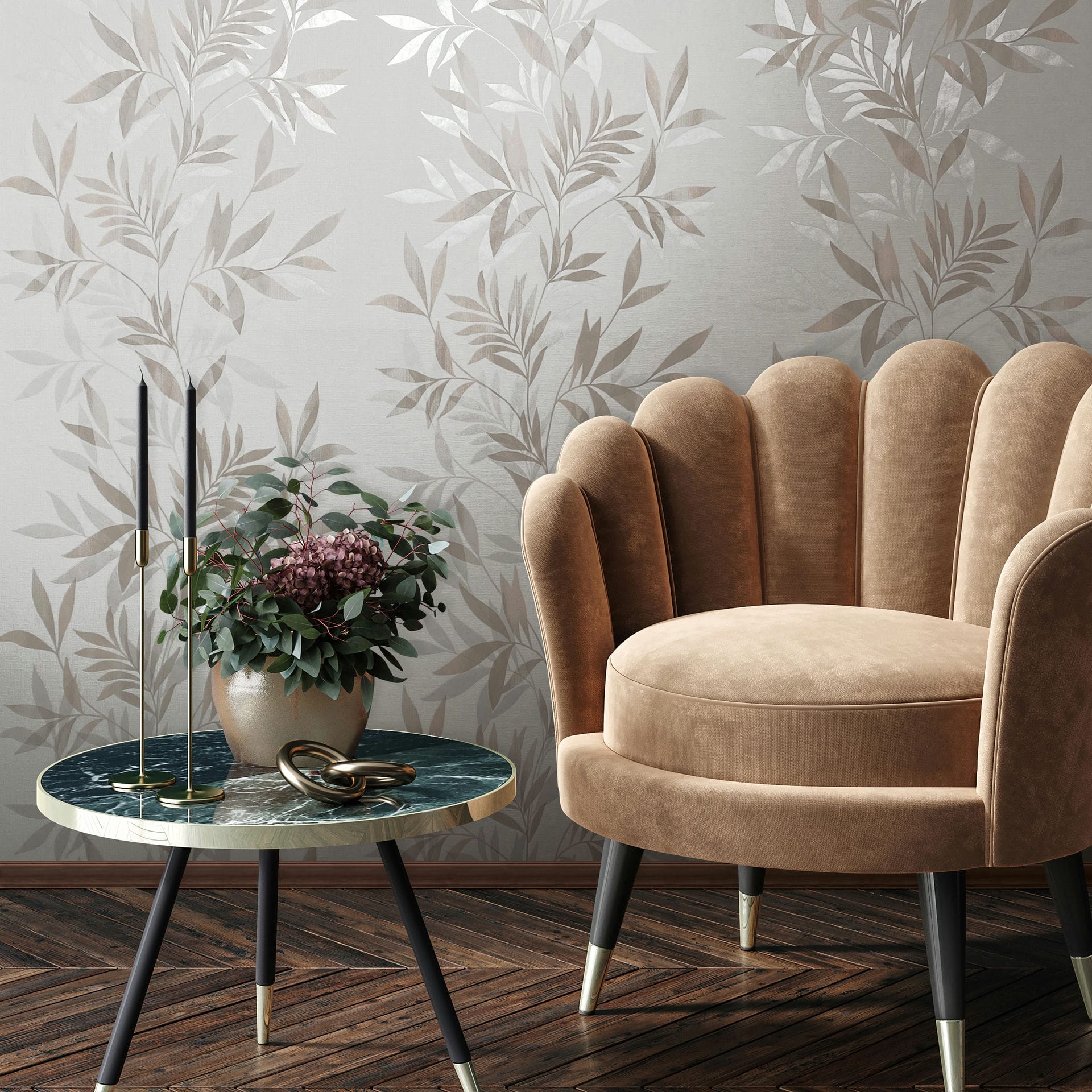 Marburg Mona 82459 Beige leaf-pattern wallpaper on a light background, shown with a scalloped tan armchair, a round side table with two tall candlesticks, and a potted plant.
