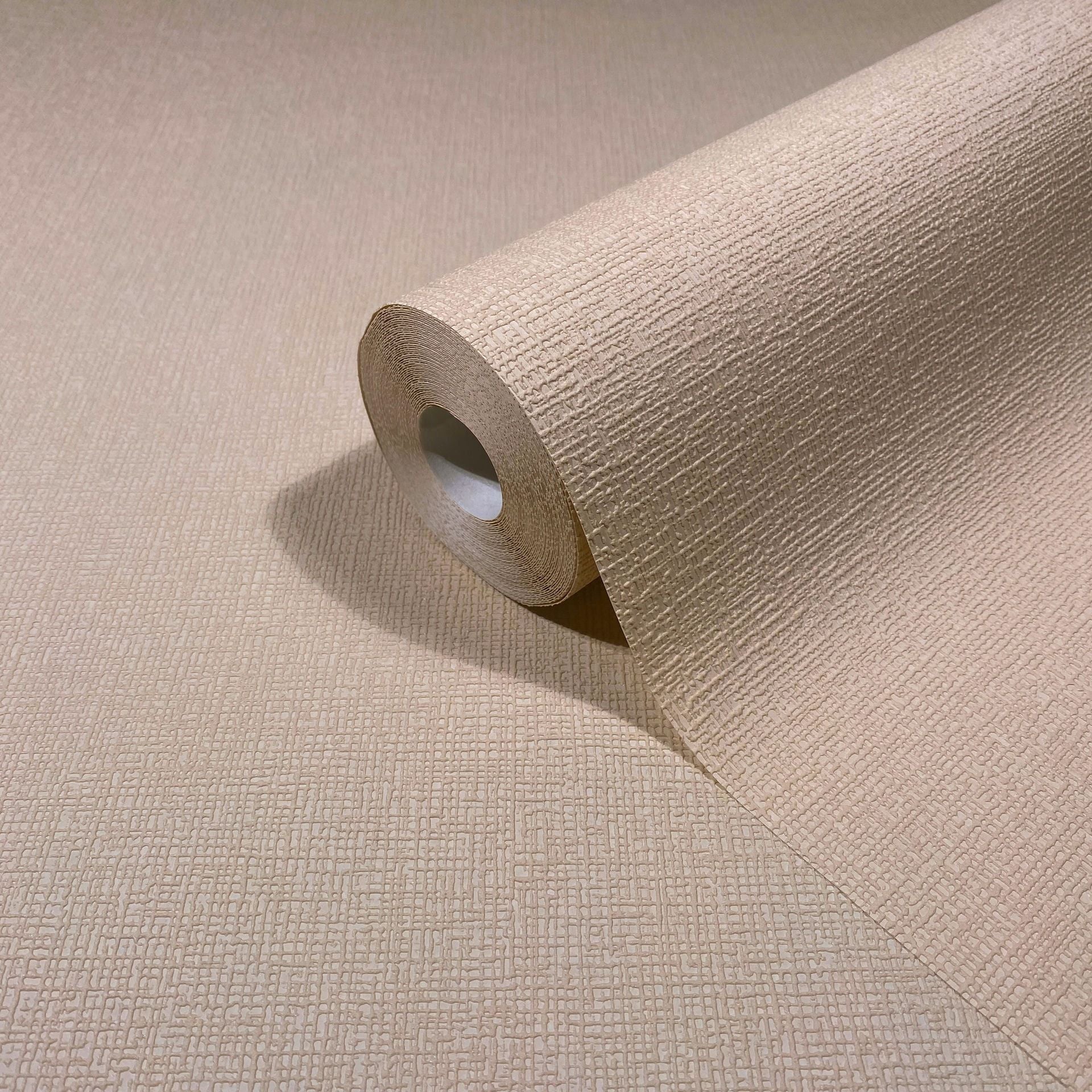 Marburg Mona 82466 Beige wallpaper roll with a raised crosshatch texture, partially unrolled on the same pattern.