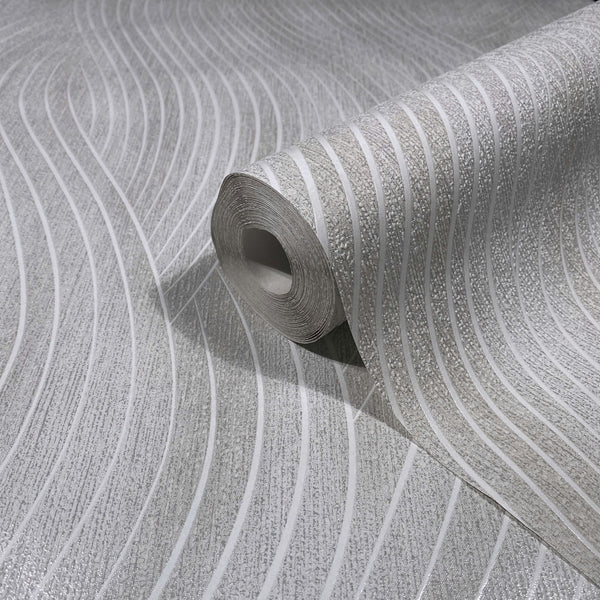Marburg Mona 82474 Wallpaper roll resting on a matching unrolled sheet, showing a gray and white wavy stripe pattern with textured detail.