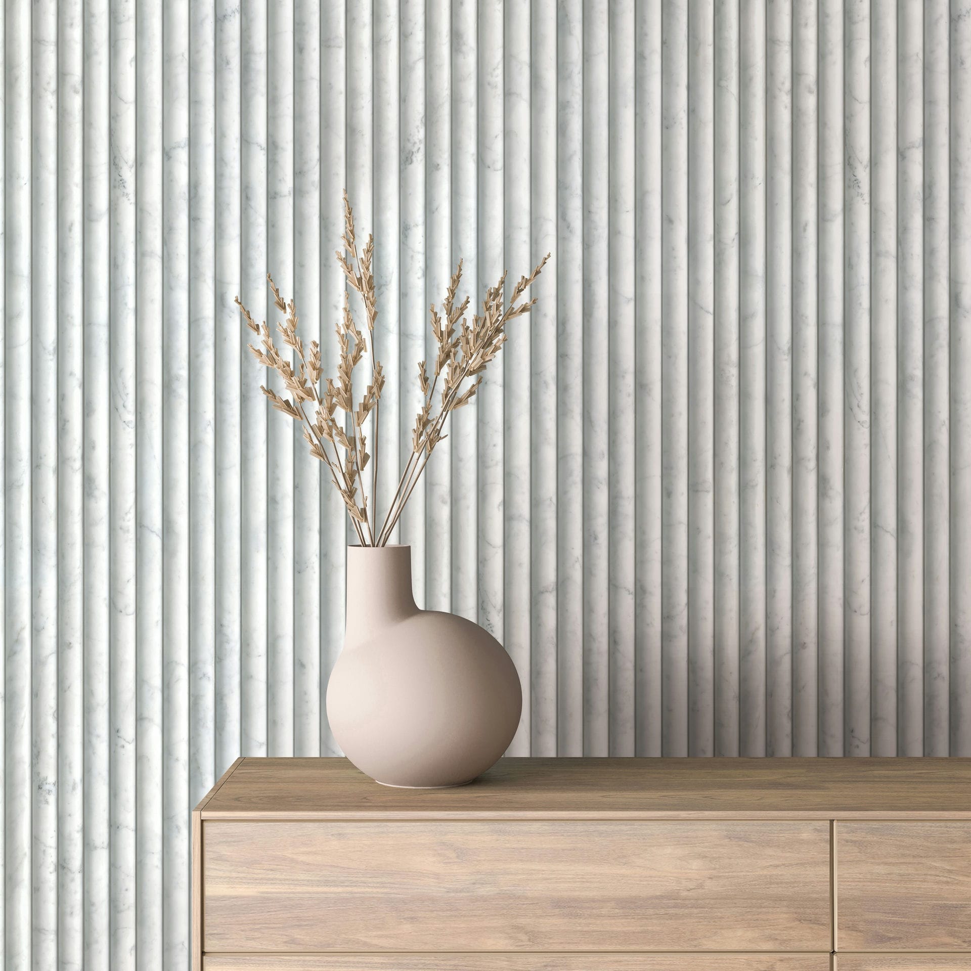 Marburg Mona 89005 Light gray marble-look wallpaper with narrow vertical fluted stripes, shown behind a beige vase with dried stems on a wood dresser.