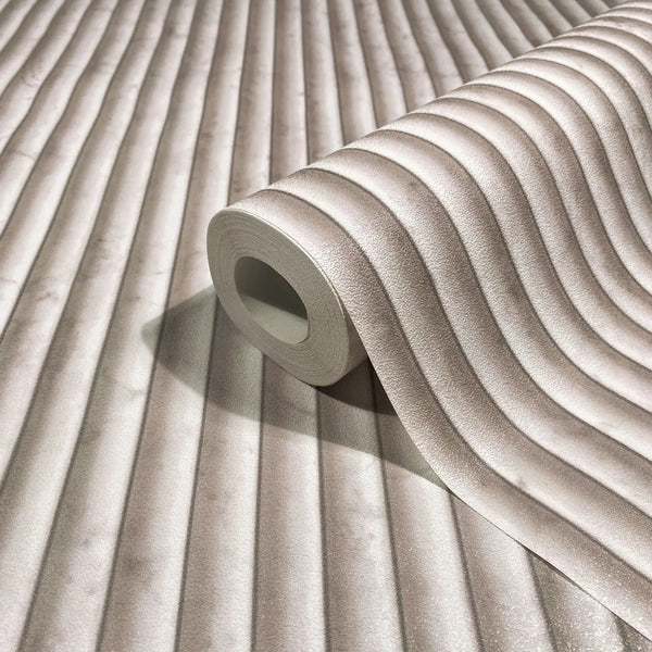 Marburg Mona 89006 Wallpaper roll on a matching surface showing a beige ribbed, softly wavy stripe pattern with a subtle 3D effect.