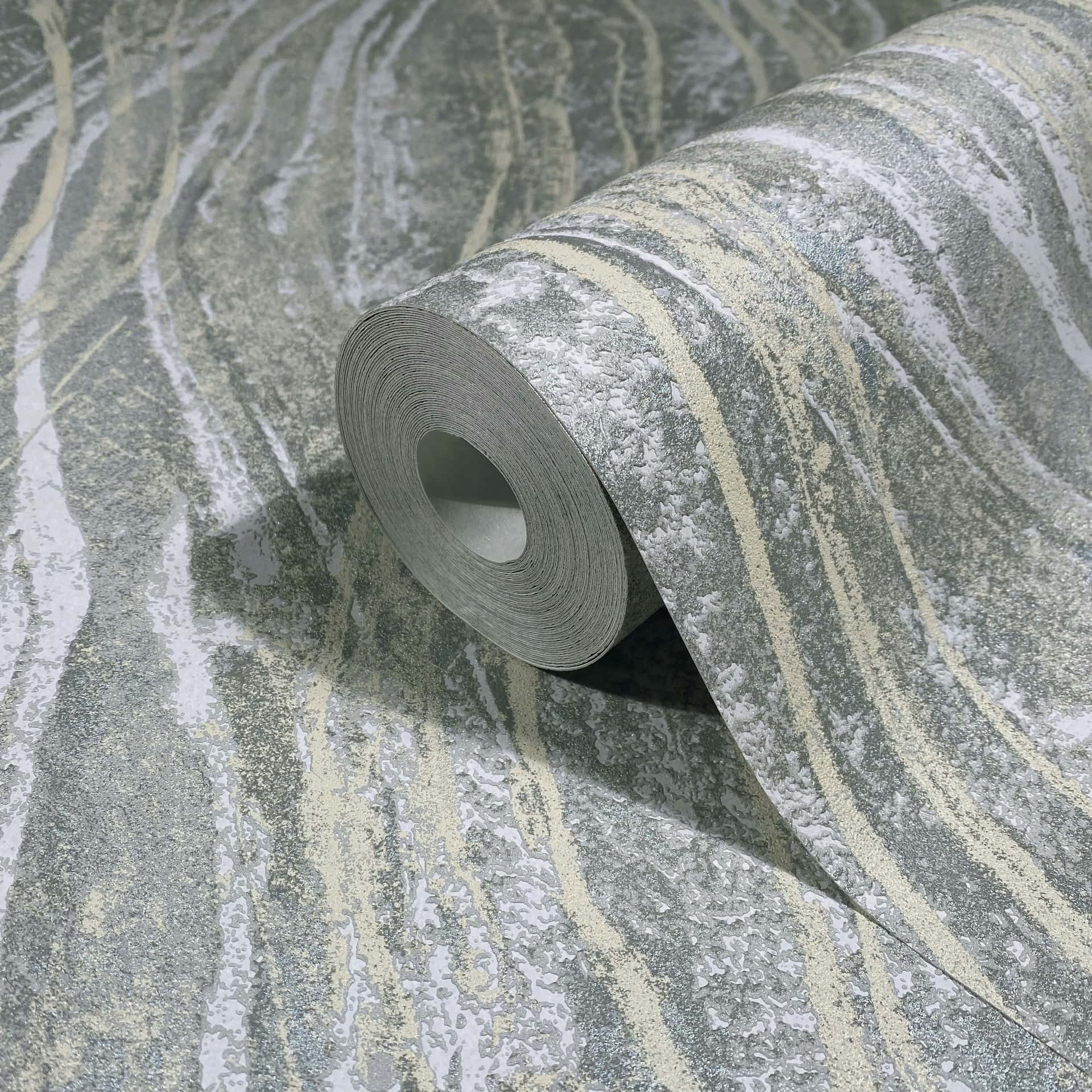 Marburg Naomi 82494 Close-up of a gray wallpaper roll with abstract wavy stone-like veining in light beige, shown on a matching unrolled sheet.
