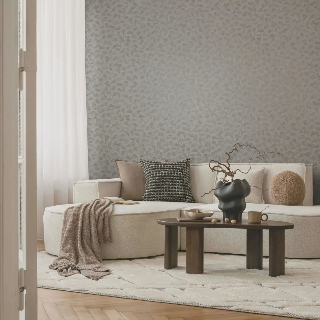 Marburg Naomi 82502 Wallpaper showing a gray botanical design with branching stems and rounded leaves over a light textured background.