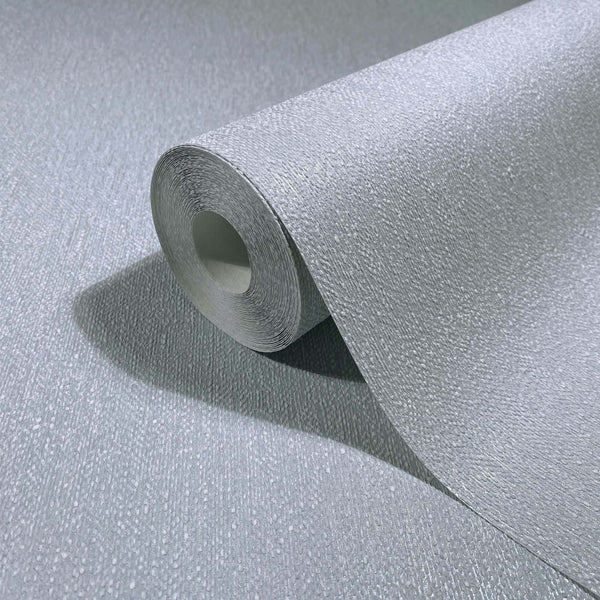 Marburg Naomi 82535 Close-up of a light blue-grey textured wallpaper roll with small speckles and fine linear grain, shown on the same material.