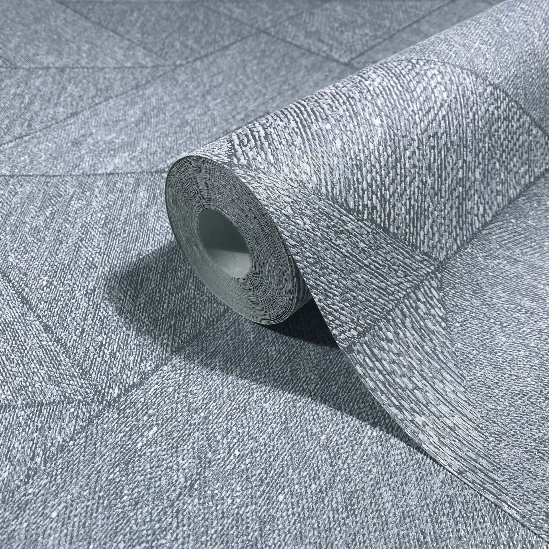 Marburg Naomi 82547 Blue-gray wallpaper with fine speckled dashes creating a textured look, arranged in large geometric/ wallpaper roll showing its textured surface and finish.