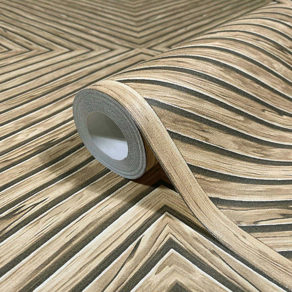 Marburg Naomi 89019 Close-up product view of a wallpaper roll on matching unrolled wallpaper showing a beige woodgrain-effect chevron pattern with dark accent lines.