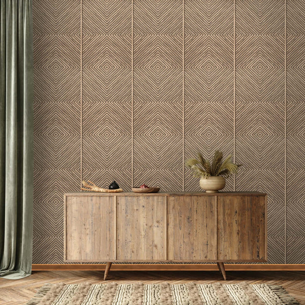 Marburg Naomi 89019 Room scene showing neutral geometric diamond line wallpaper behind a wood sideboard with a vase of dried grasses and small bowls, a green curtain at left, textured rug, and herringbone wood floor.